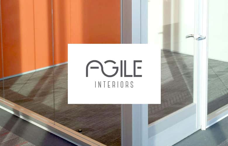 Agile Interiors logo over close up of office with glass walls
