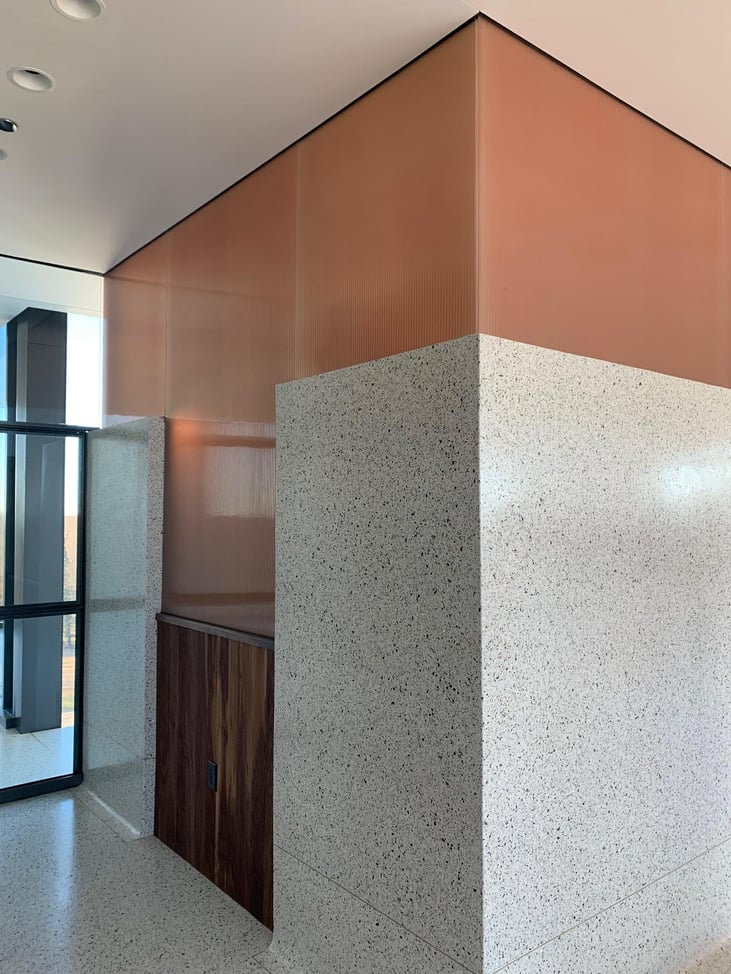 color-matched laminated glass accent wall for bar area of restaurant