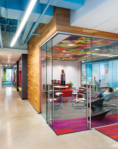 Large modern office with wide open glass office walls