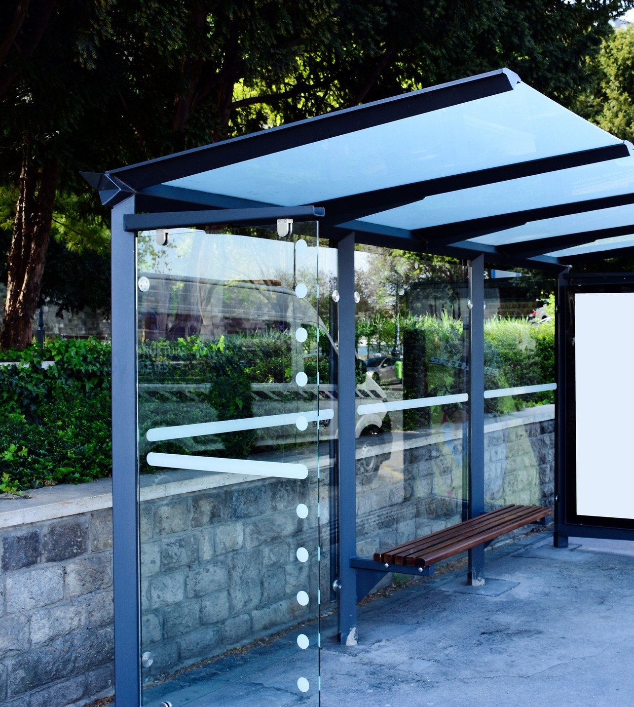 Bus stop with glass dividers