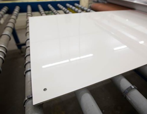 Close up of White markerboard on warehouse rollers