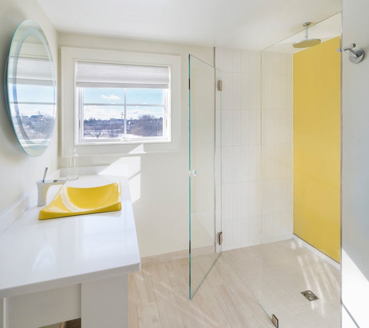 Back painted glass in bathroom with glass door shower