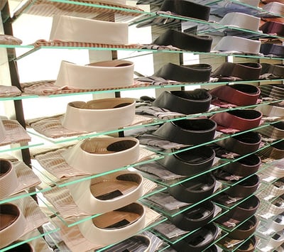 Glass shelves with dress shirts on top