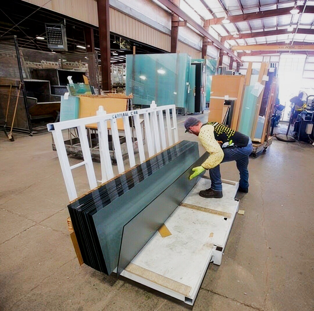 Dillmeier warehouse worker moving glass on pallets