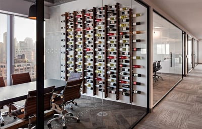 Scott Spector modern office with wine bottles and glass office walls