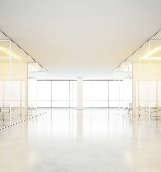 Beautifully lit room with glass offices and windows