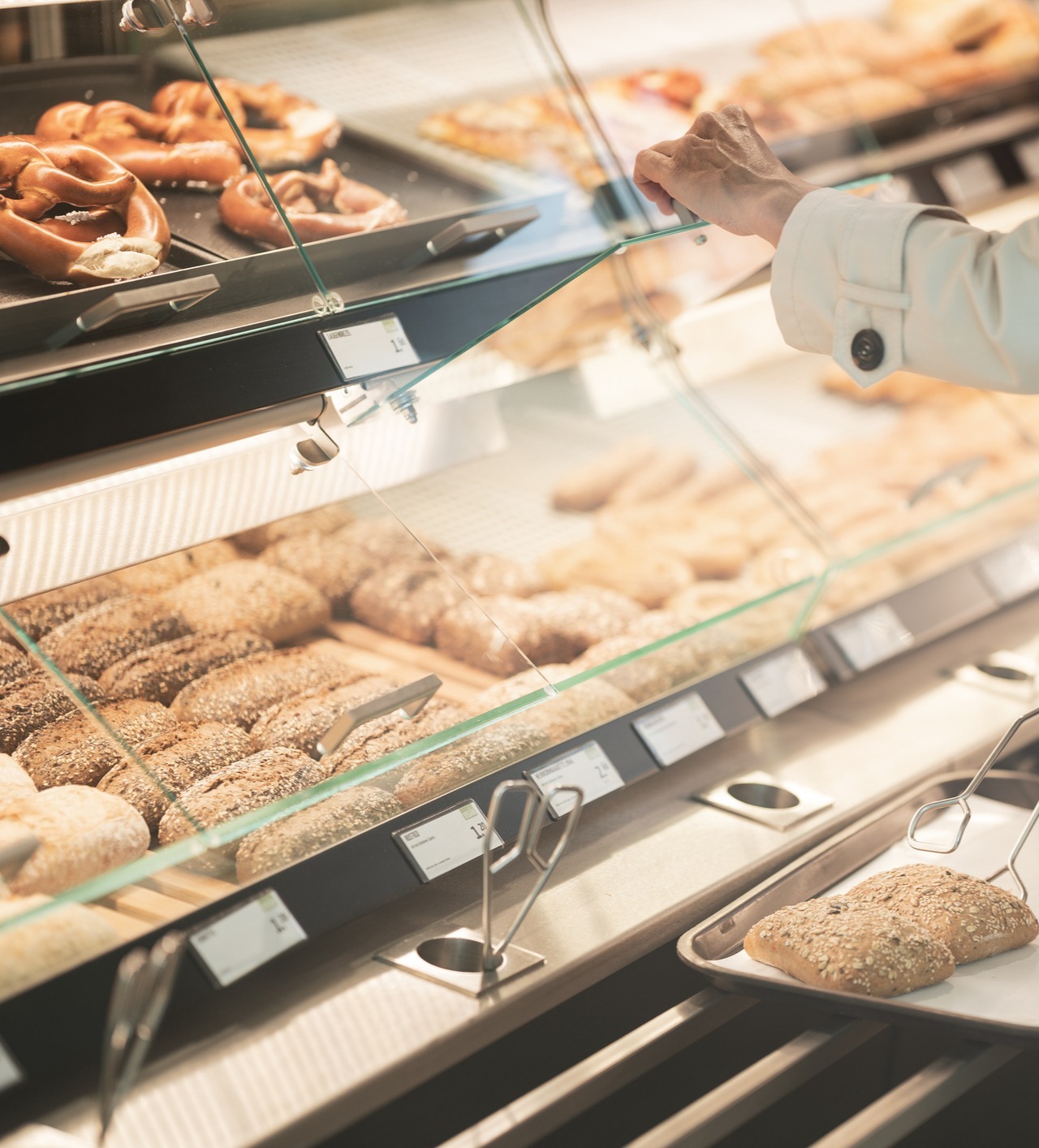 Glass displays of fresh bread in bakery