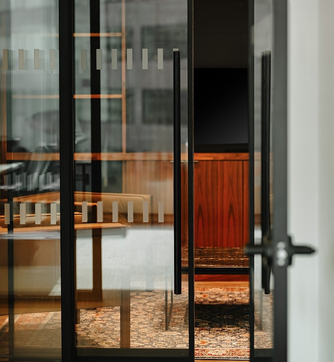 Modern office with glass doors and decoration on glass