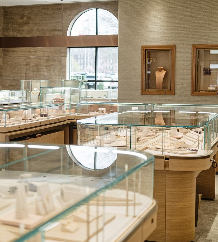 Retail glass displays of jewelry in luxury jewelry store