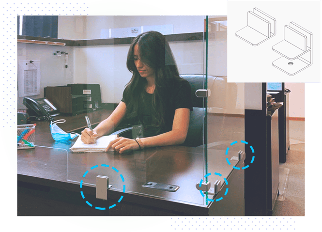 Dillmeiers Glasses Clamp System on display in office setting with worker and clamp diagram.png