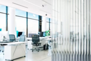 Reeded glass closeup with city office setting in background